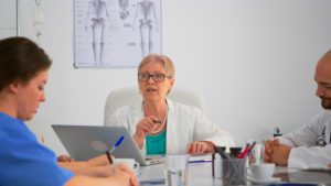 Female doctor leading team meeting