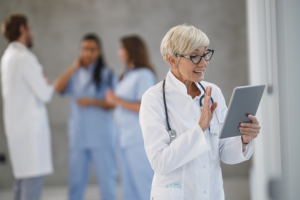 Female doctor on tablet