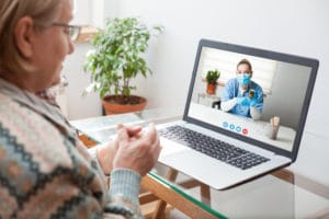 woman on video call with female doctor