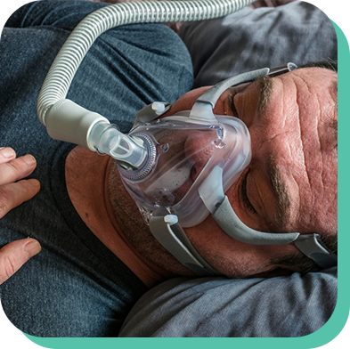 Man on mechanical ventilation system at home who receives remote support by their care team
