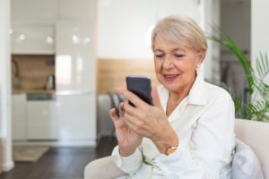 Woman holding phone and looking at it